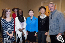 First Lady Yumi Hogan center in blue with student artists and attendees