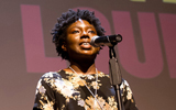 Sharese Acheampong recites poetry during the POL competition, photo by Edwin Remsberg