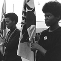 Black Panthers women drilling with Panther flags - Photo courtesy of Pirkle Jones and Ruth Marion Baruch