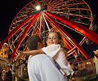 Father and little girl at a fair
