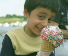 Little boy enjoying an ice cream cone.
