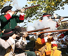 Reenactors shooting their rifles to celebrate Maryland Day.