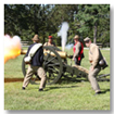 Civil War soldiers firing a canon
